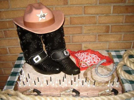 Cowboy boots and hat cake by Myrtle van den Berg