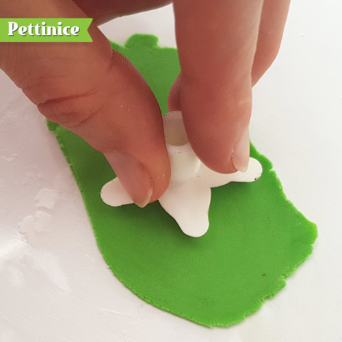 Roll out a very thin piece of green fondant.
