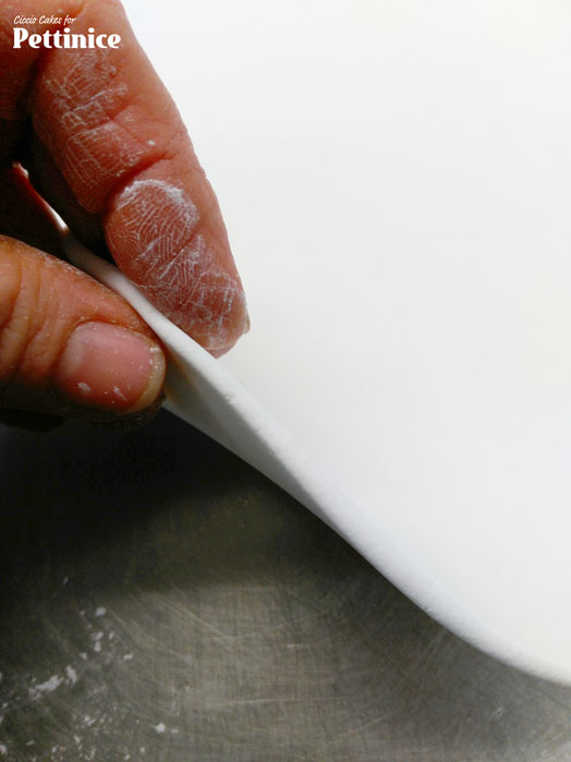 First, create a gumpaste by adding a hardening agent such as tylose to your Pettinice.  Roll your Pettinice relatively thick.