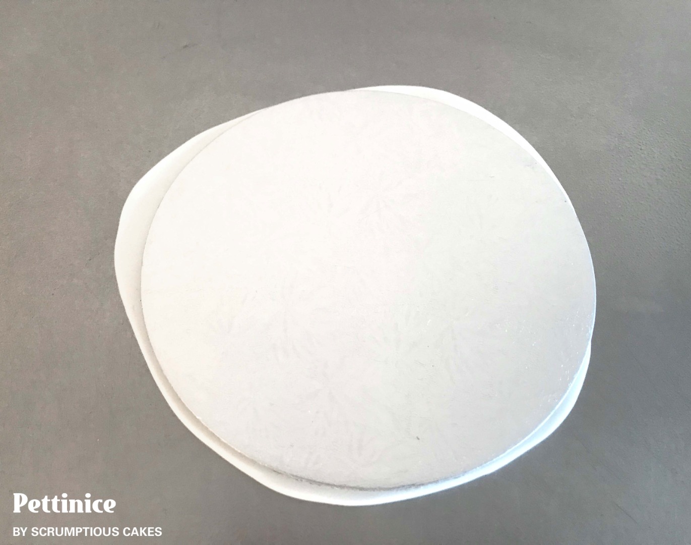 Try to roll it out with just the Sprink under the icing and nothing on top. I rolled it to 9" in diameter, to cover a 6" cake.