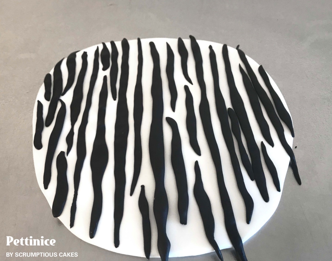 Push each sausage into the white icing not so much that it is flat but enough so that they stick.