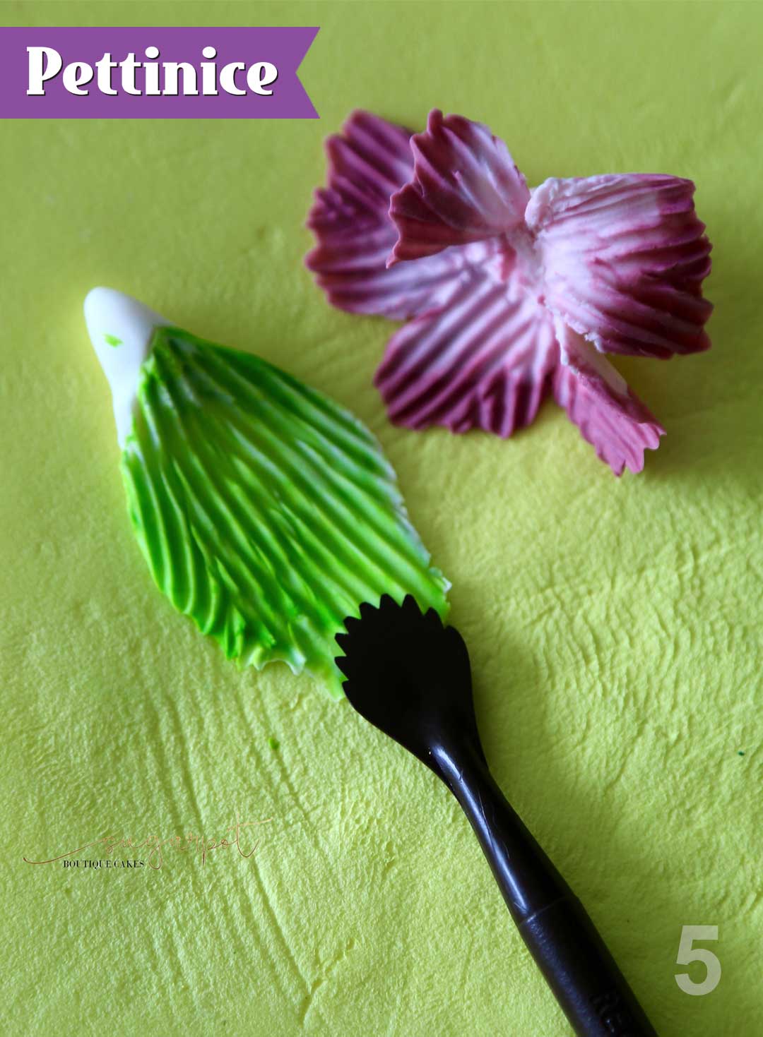 Step 5:  Use your shell veining tool and pull away from the centre of the flower, and away from the leaf to emboss texture and create shape.