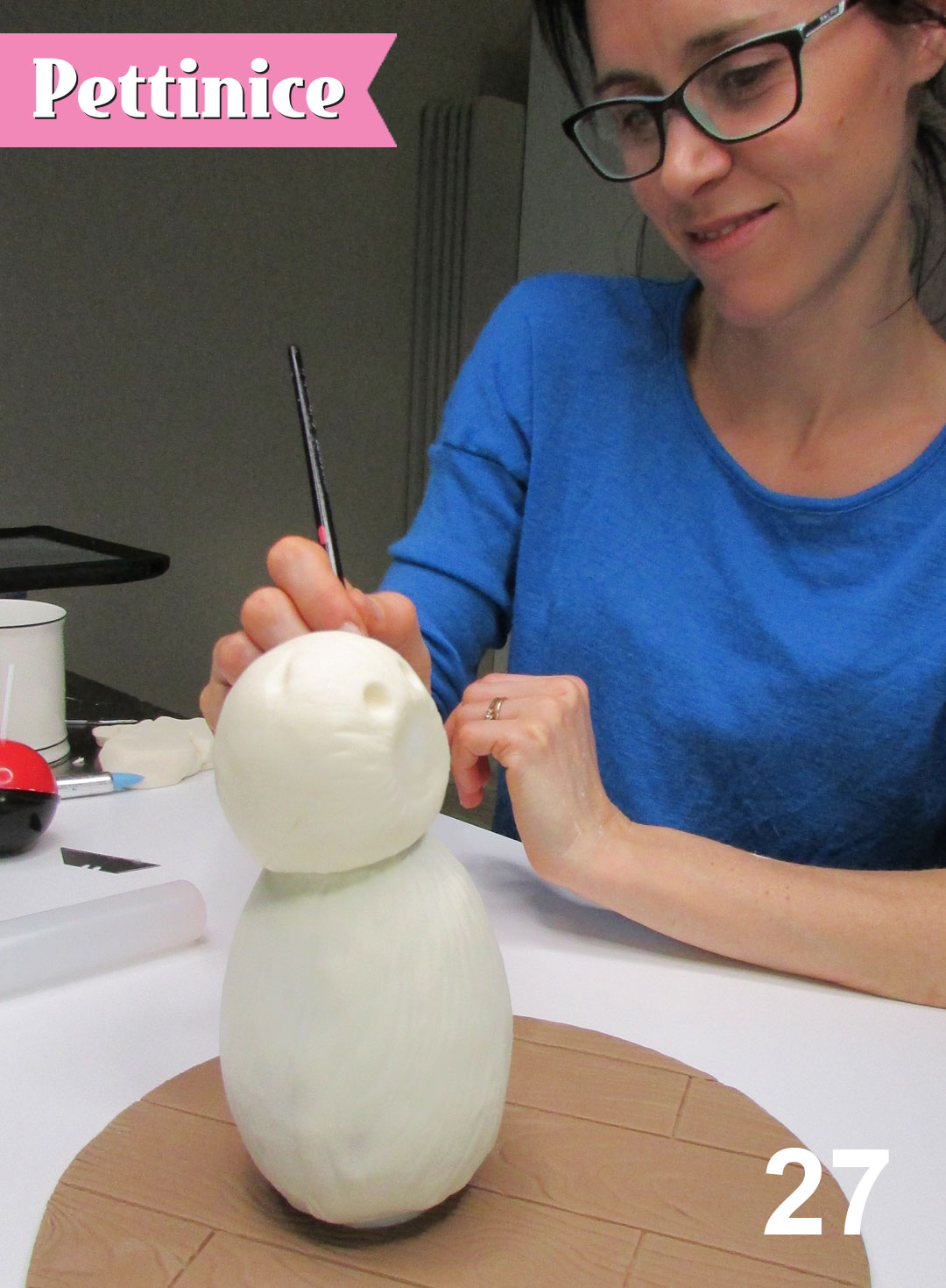 Step 27: Hold your teddy body in place until chocolate sets.  Use your clay tools to fix any areas as needed.