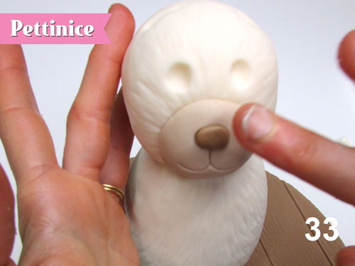 Step 33: Roll a little ball into a nose and press in place.