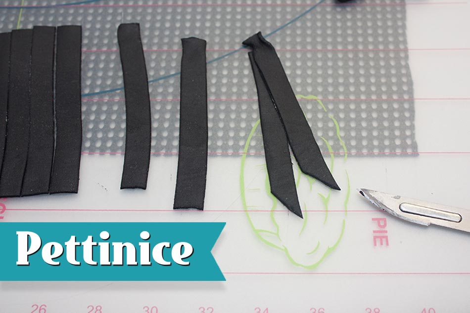 Cut both the bottom of the strips at a 45˚ angle in the same direction with one about 1cm shorter than the other and attach at the top with a little sugar glue.