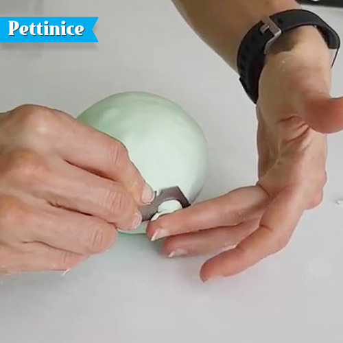 Remove excess fondant from the bottom