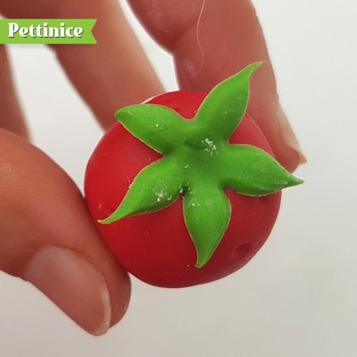 Add to the top of the strawberry with a bit of water. Indent the top a bit in the centre so your stem will have a nook to sit in.