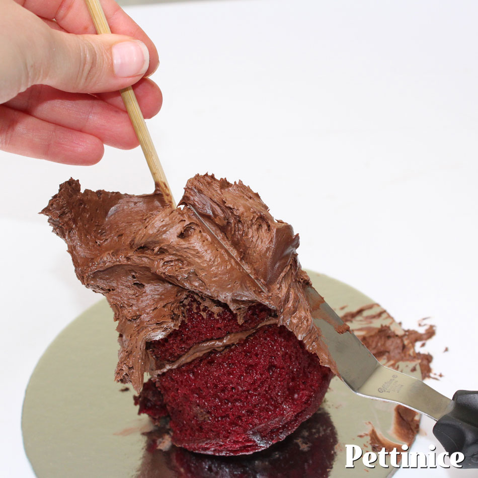Use a skewer to help you keep the cupcake still while you coat in ganache or buttercream.