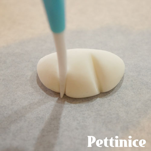Use your dresden tool to emboss paw details.
