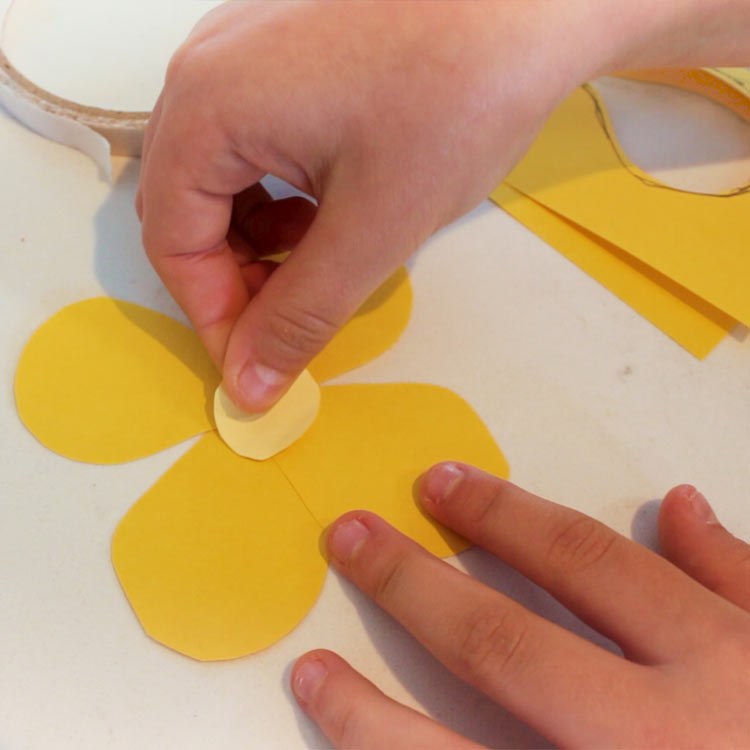 Cut a little circle for the center and stick it in the middle of your flower.