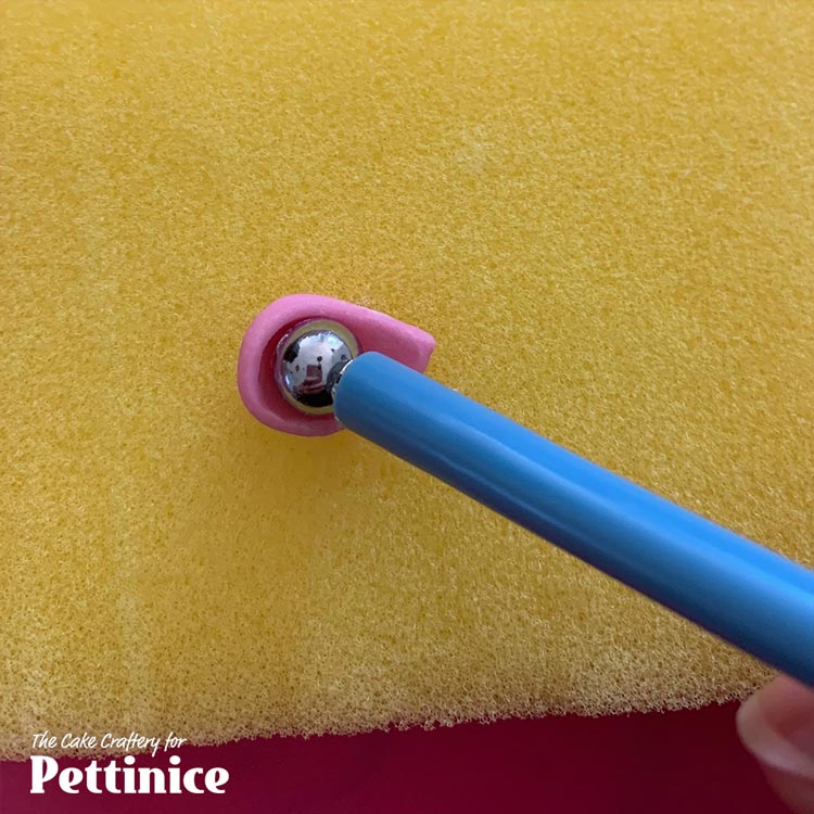 Press small ball tool into centre, supporting with your sponge or your palm.