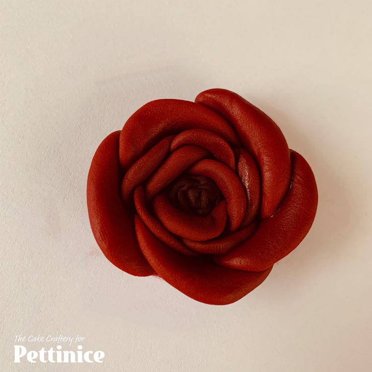 Repeat the process with  5 x 1.5 cm sausages out of the mid ruby red (1.8g/marble sized) Continue wrapping around to make the 3rd layer of petals.