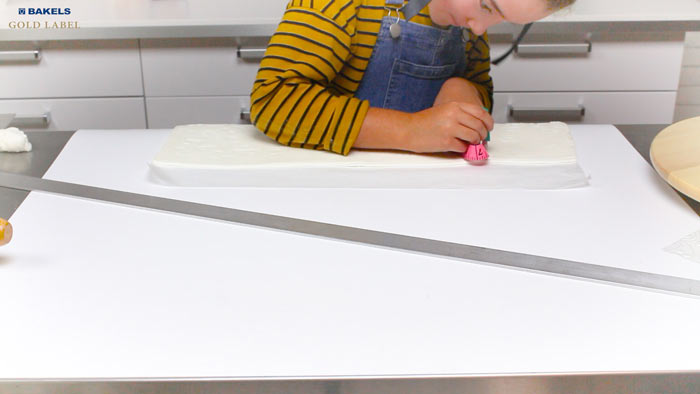 Trim straight edges for the height. To make it easier later, put this panel on a cookie sheet and put it in the fridge to harden.