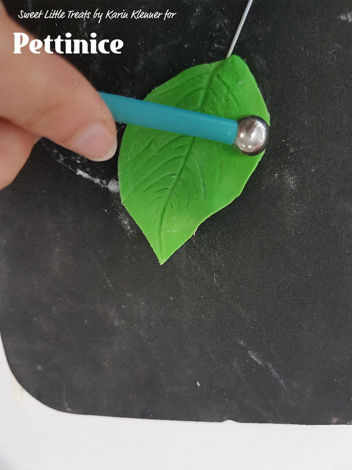 Use your ball tool to thin out the sides of your leaf and ruffle them a little.