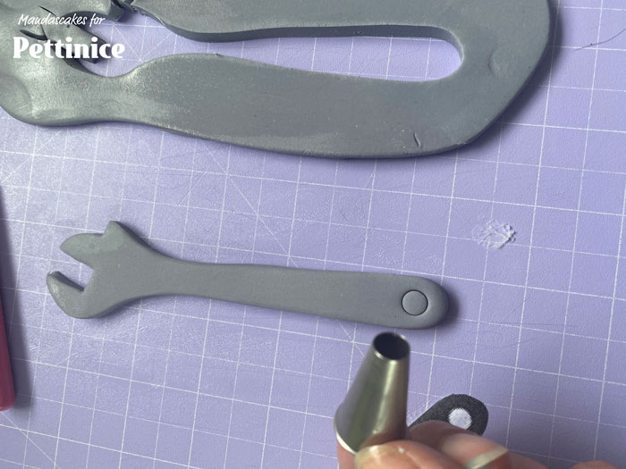 Use a small circle cutter to cut a hole in the end (optional as this will actually be hidden in the end).