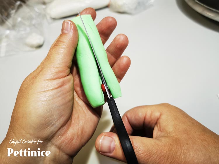 Use your scissors to cut thick 3 triangular strips for lime segments.