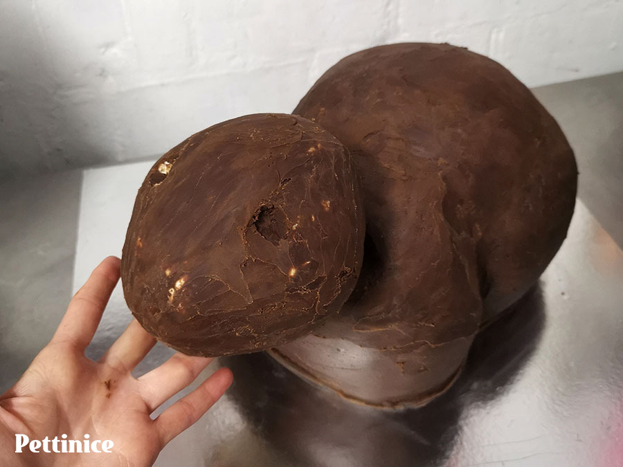 Make sure the head fits on the shoulders. If not, carve a bit of cake out of the way and ganache again.  Place the head on a thin cake card cut to exactly the size of the head.