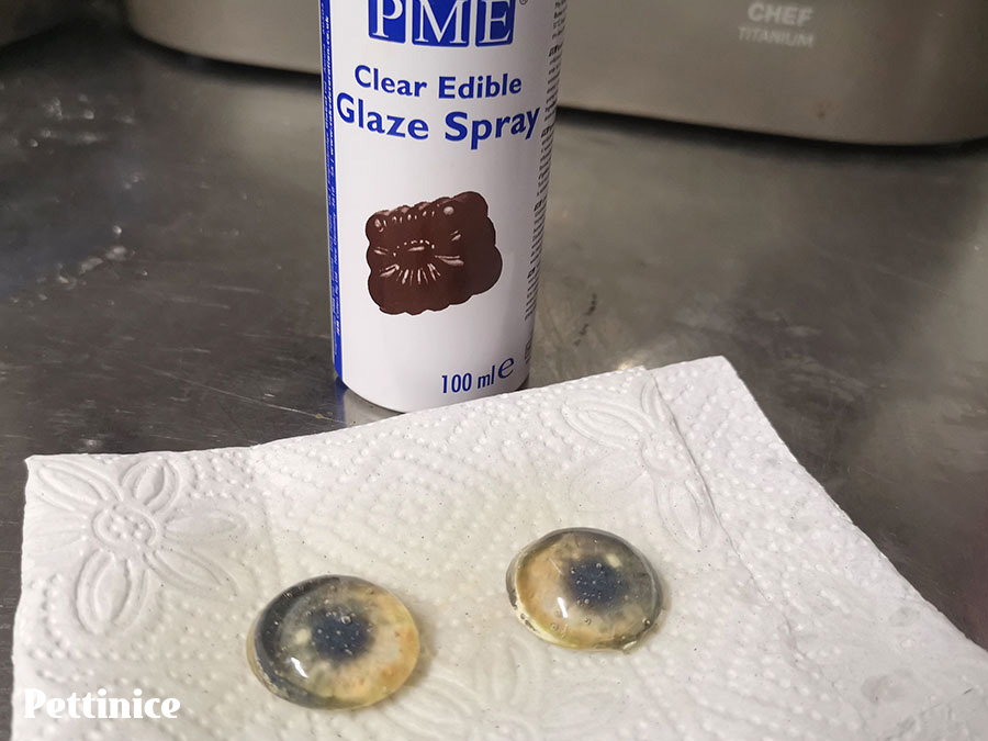 Apply an edible glaze spray to keep your eyes clear. If you don't apply this, they will become dull.