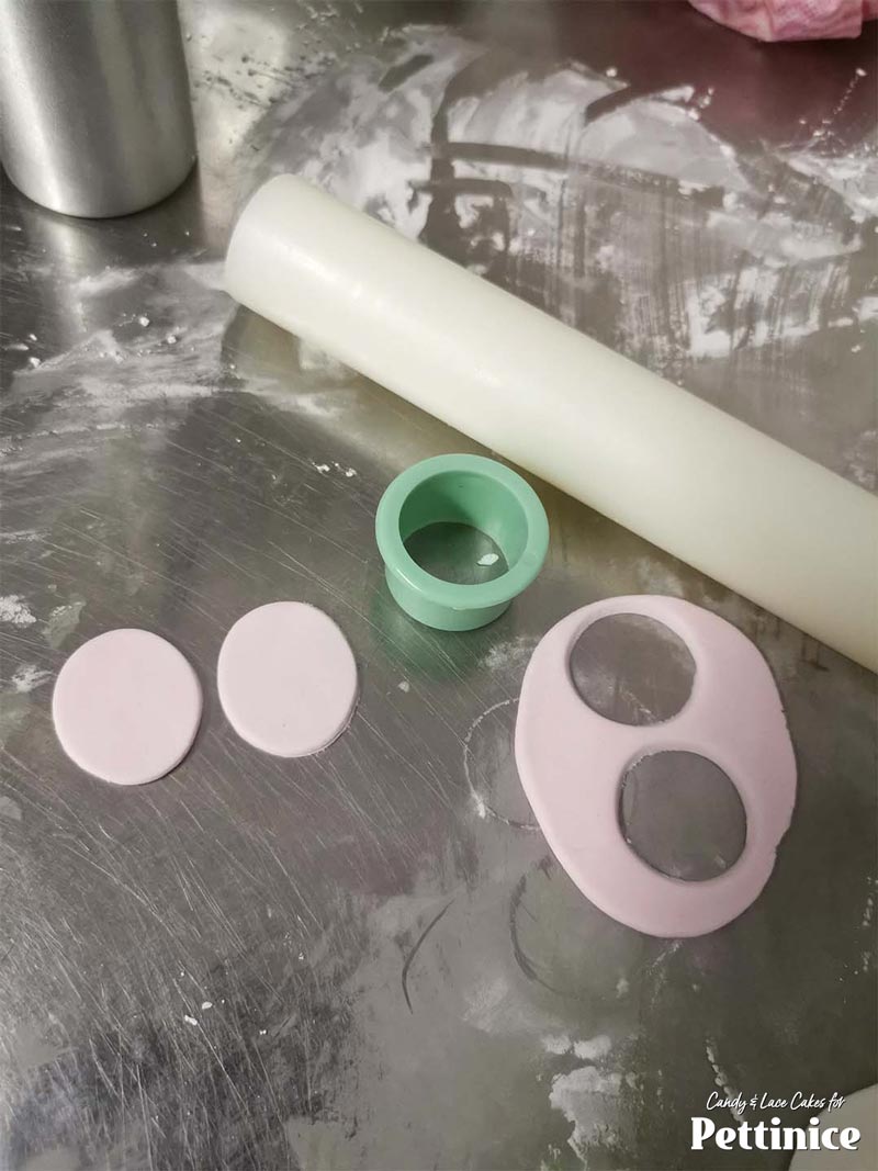 Cut two light pink circles and roll over them just once with your rolling pin to make them a little more oblong shaped. These are his cheeks :)